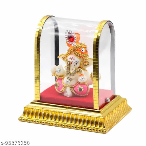 Gold acrylic glass box with Lord Ganesh idol and red velvet background, car dashboard decoration