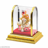 Gold acrylic glass box with Lord Ganesh idol and red velvet background, car dashboard decoration