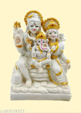 White idols of Lord Shiv, Goddess Parvati, and Lord Ganesha in a family setting, temple-style decoration