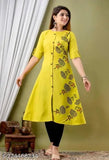 Green printed quirky round cotton kurti with short sleeves, featuring delicate lace detailing and a V-neck. Made in India