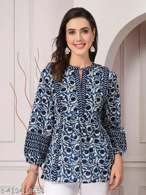 Navy blue floral printed viscose top with three-quarter sleeves, round neck. Women's fashion on mannequin." (120 characters)