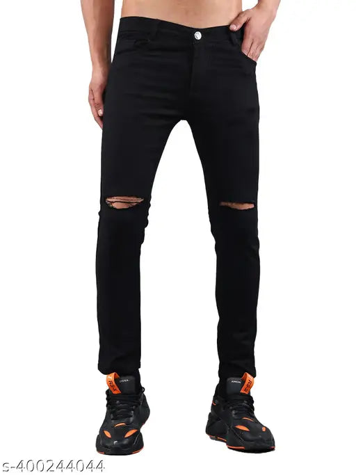 Black stretchable mid-rise denim jeans for men, solid black knee cut design on model