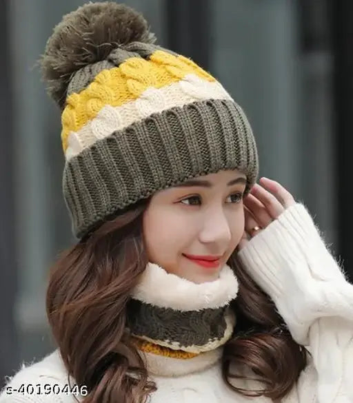 Green and beige knit hat, ribbed cuffs with fur trim on a girl posing