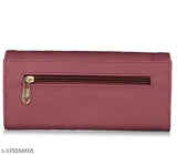 Maroon leather wallet with a zipper and card slots, from the side