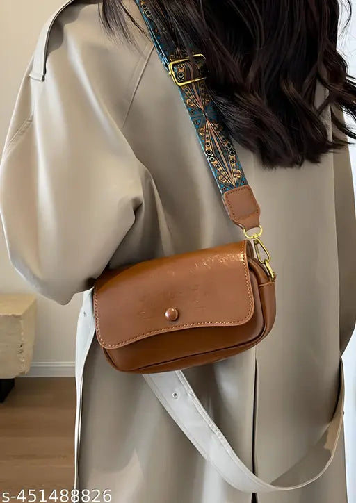 Women's trendy cross-body mini sling bag, likely leather or suede, small size
