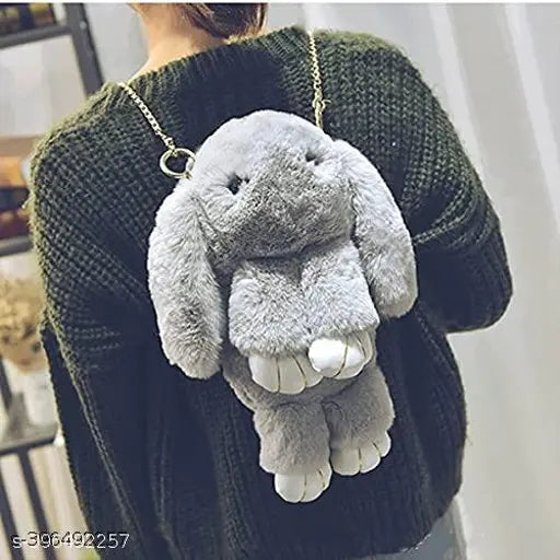 Gray faux fur backpack with teddy bear design and chain shoulder strap