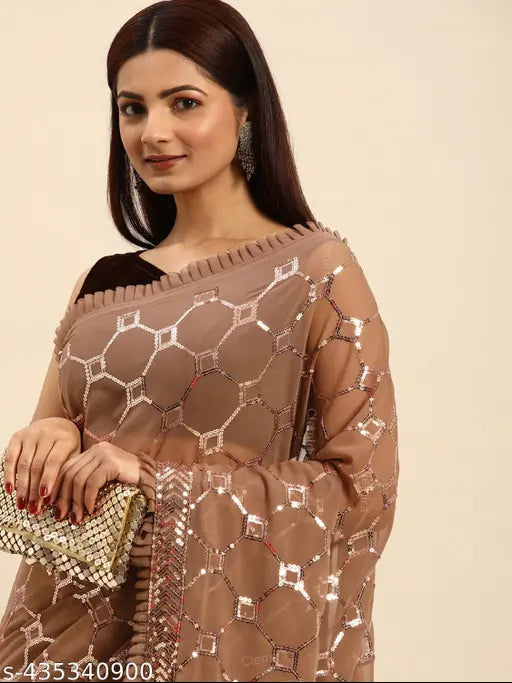 Woman wearing a long brown and gold sequined saree