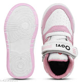 Pink and white sports shoes for kids, featuring a Velcro strap and flat sole