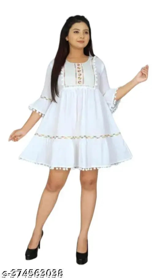 White crepe knee-length kurti with intricate embroidery, perfect for festive occasions. Embroidered net pattern on three-quarter sleeves
