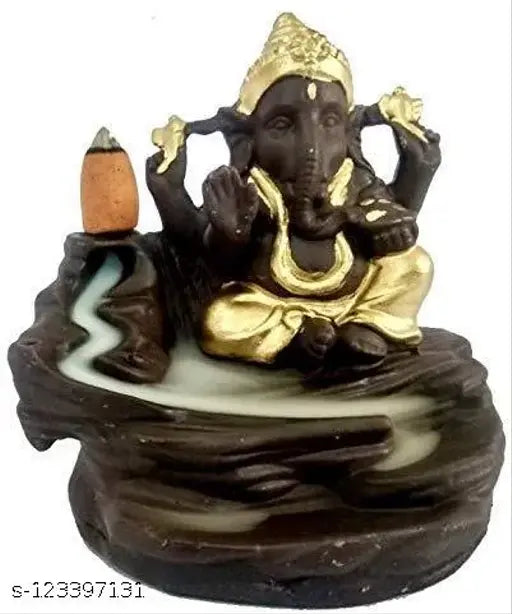 Gold idol with Lord Ganesha sitting on a river, in a circular stone structure