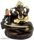 Gold idol with Lord Ganesha sitting on a river, in a circular stone structure