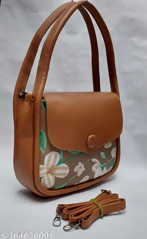 Brown leather purse with floral design, strap