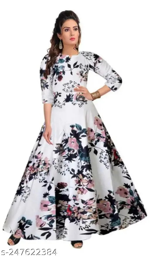 White rayon Anarkali gown with three-quarter sleeves and floral print, popular for girls' fashion