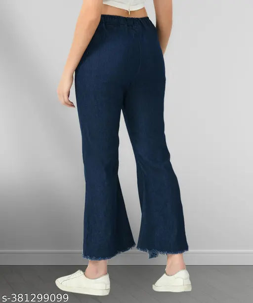 Dark blue stretchable denim flared jeans, with wash effect, long rolled-up cuffs and elastic waist. Plus size options for women