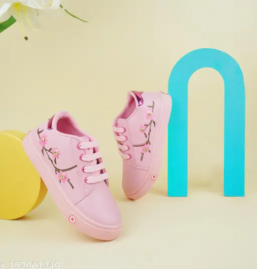 Pink sneakers with floral detailing, lace closure