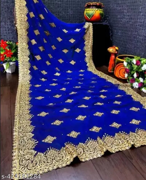 Deep blue silk saree with detailed embroidery and contrasting golden pallu