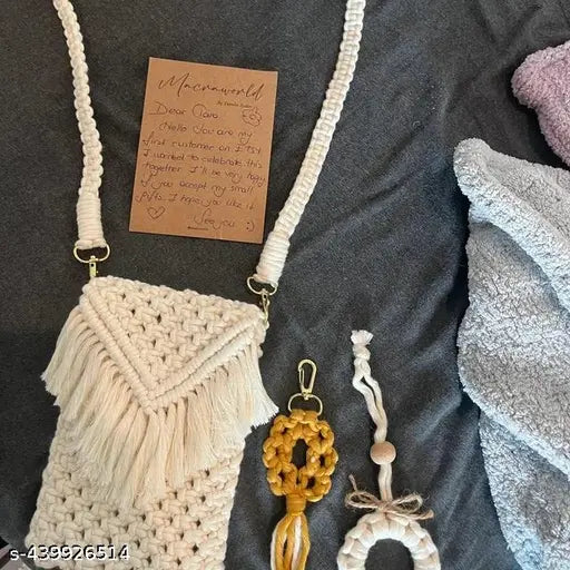 A craftwave handmade macramé mobile bag, featuring a boho-style design with a soft strap and eco-friendly durable cotton cord. It's ideal for casual outings, festivals, and everyday use
