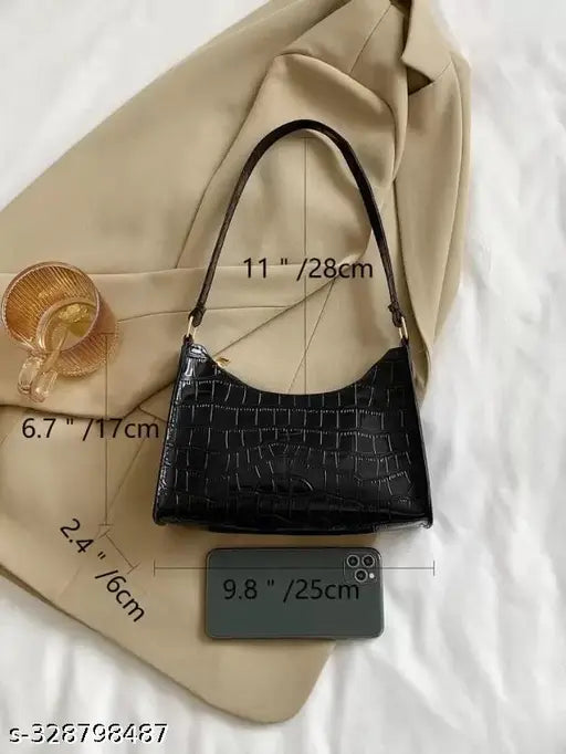 Black sling bag, adjustable strap, likely leather or faux leather