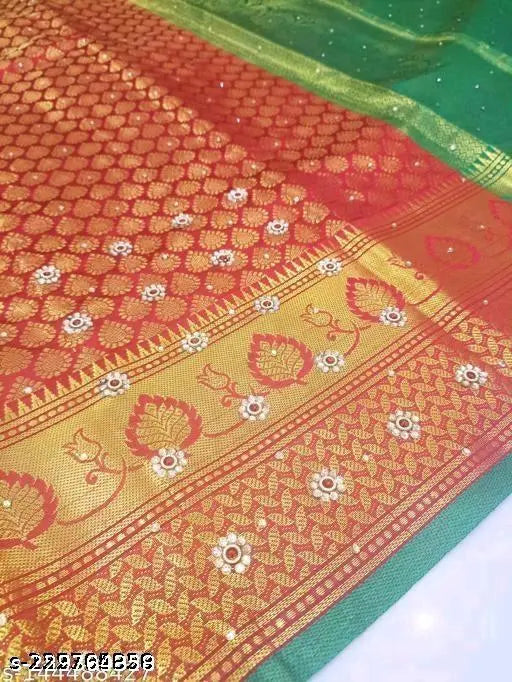 A vibrant red brocade silk saree with gold borders