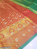 A vibrant red brocade silk saree with gold borders