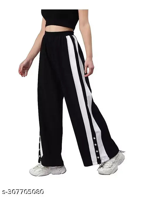Black track pants with white stripes, flared fit