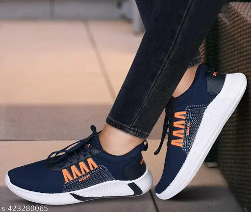 Navy blue athletic shoes with orange accents