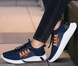 Navy blue athletic shoes with orange accents