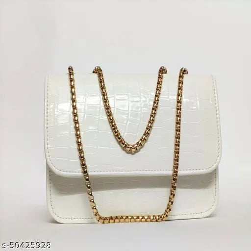 White sling bag with gold accents, zipper closure, trendy fashion accessory