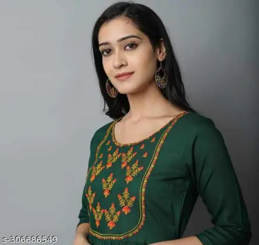 Green rayon cotton kurti, three-quarter sleeve, embroidered pattern. Women's rayon kurti from India on display