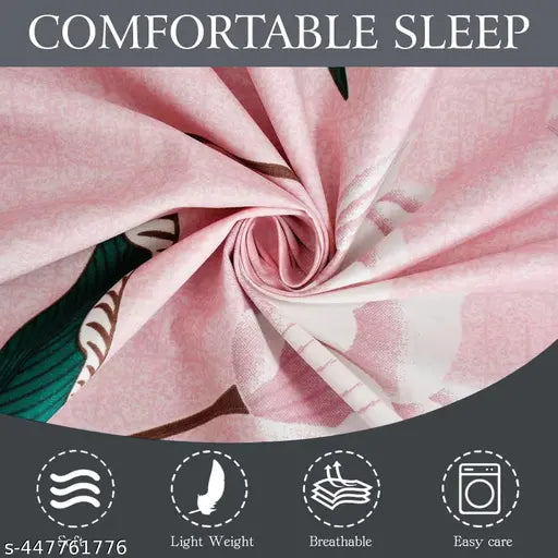 Light pink cotton queen sheet with feather detail, breathable, easy care.