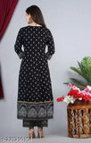 Women's rayon printed Anarkali Kurta set with palazzos and dupatta, features three-quarter sleeves and a vibrant print design. Rayon fabric. Indian handcrafted ethnic wear on display