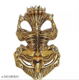 Gold metal decorative wall hanging with intricate designs representing a deity's face