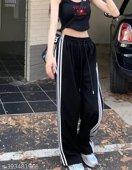 Black athletic track pants with white stripes and a drawstring waist