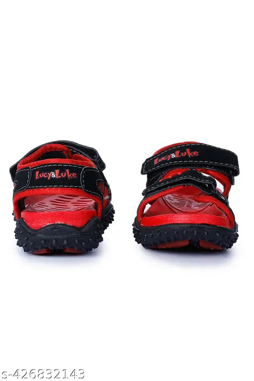 Red and black children's sandals by Lucy & Luke, featuring a Velcro closure