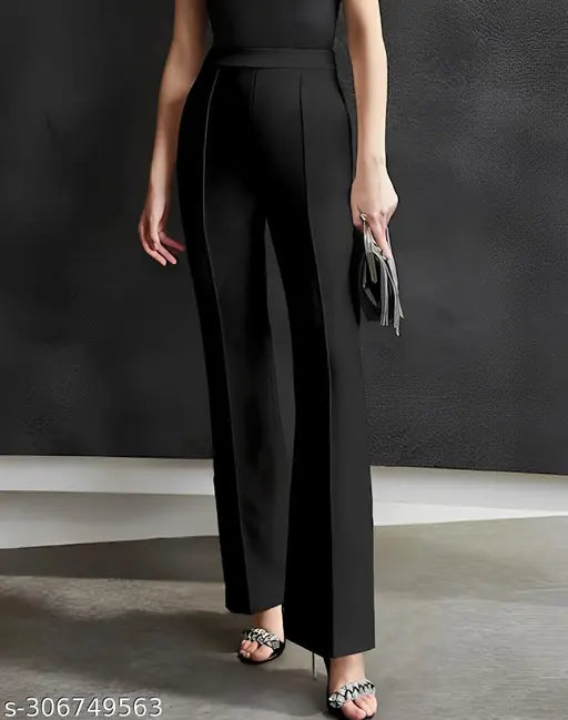 Black cropped jumpsuit with wide legs and ankle straps