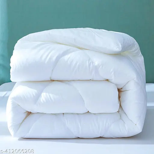 White quilt, soft texture, folded at center