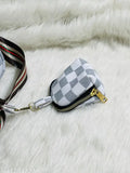 Women's cross body strap sling bag with coin pouch, possibly black or gray with a white coin pouch, featuring a black strap