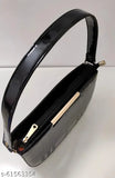 Black slingbag with a box pattern, short shoulder strap, and lightweight design