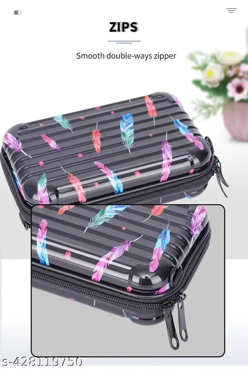 Multi-colored, leaf print fiber mini suitcase with adjustable strap
