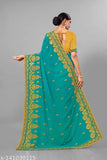 Teal georgette saree with heavy diamond work and elaborate embroidery