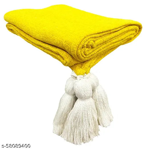 Soft blanket, folded, fringe ends