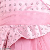 Pink satin party dress with ruffled hem