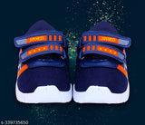 Orange and black casual shoes with Velcro straps and lightweight design, suitable for outdoor sports