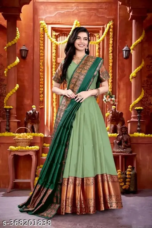 South Indian cotton silk and chanderi silks Lehenga Choli set for women, featuring jacquard stitch, solid top, and zari patterned bottom. Unstitched piece in sizes 13-14, 14-15, 15-16, and free size