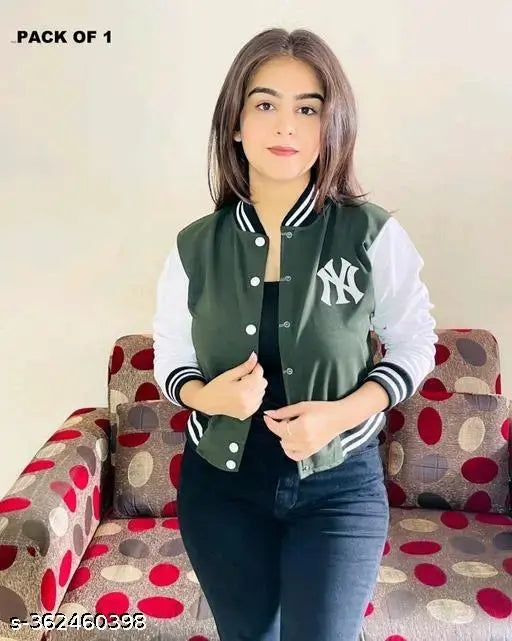 A young woman posing in a green New York jacket with full sleeves, appearing solid in color