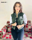 A young woman posing in a green New York jacket with full sleeves, appearing solid in color
