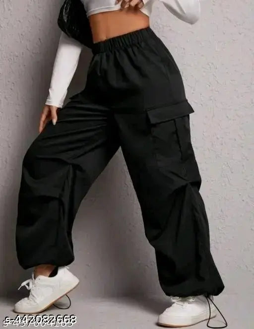 Black cargo pants with elastic waistbands, large side pockets, and a relaxed fit for women's casual wear