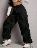 Black cargo pants with elastic waistbands, large side pockets, and a relaxed fit for women's casual wear