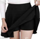 Black polycotton skater skirt with attached inner shorts and flared inskirt. Double-layered for comfort and range of motion, perfect for sports. High waistband, laser cutout scallop hem textured design. Available sizes: 26 (waist 26in, length 16in), 28 (waist 28in, length 16in), 30 (waist 30in, length 17in), 32 (waist 32in, length 17in), 34 (waist 34in, length 18in), 36 (waist 36in, length 18in). Origin: India