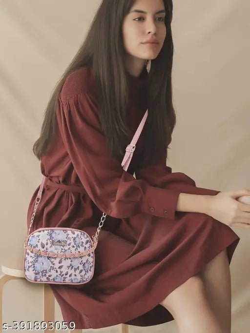 Woman wearing a red dress with a sling bag featuring two compartments